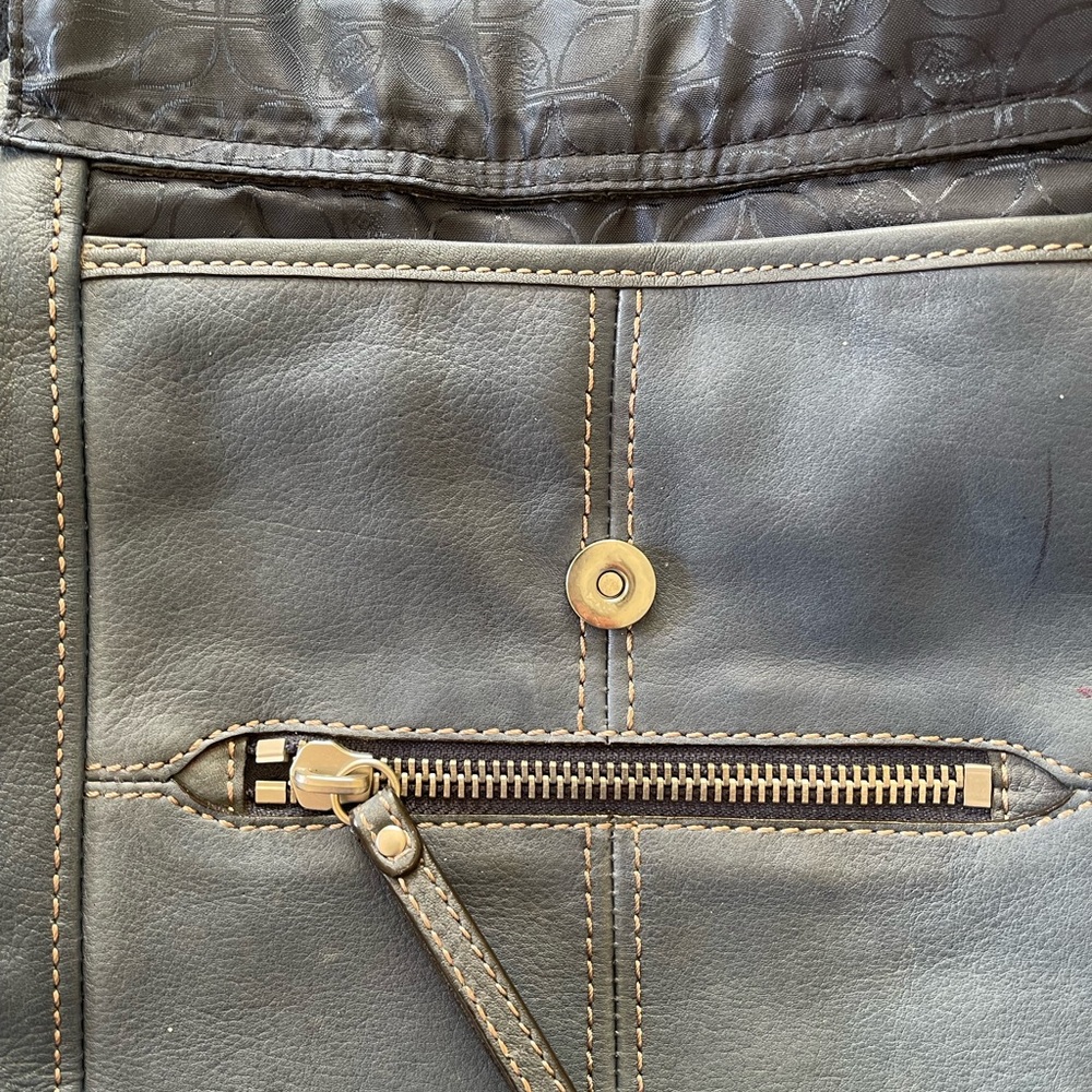 Blue pebbled cross body Fossil purse.11” long, 11” wide,